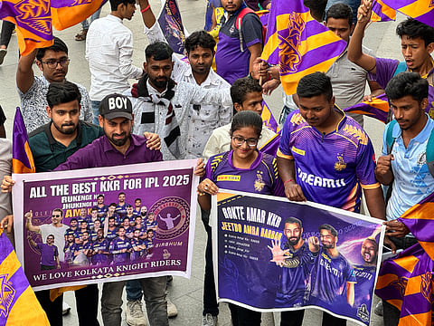 Kolkata Knight Riders fans celebrate with the IPL trophy in Durgapur.