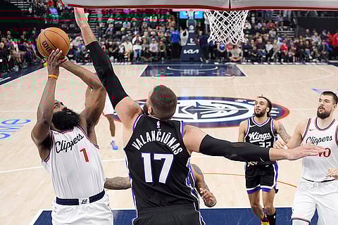 Kings vs Clippers NBA Basketball: Los Angeles Clippers guard James Harden, left, shoots