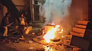 PTI : Damages after clashes that broke out during a rally celebrating the Indian team's victory over New Zealand in the Champions Trophy final, in Mhow, Uttar Pradesh, Sunday, March 9, 2025