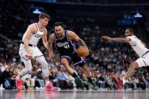 Kings vs Clippers NBA Basketball: Sacramento Kings forward Trey Lyles, center, drives Clippers guard