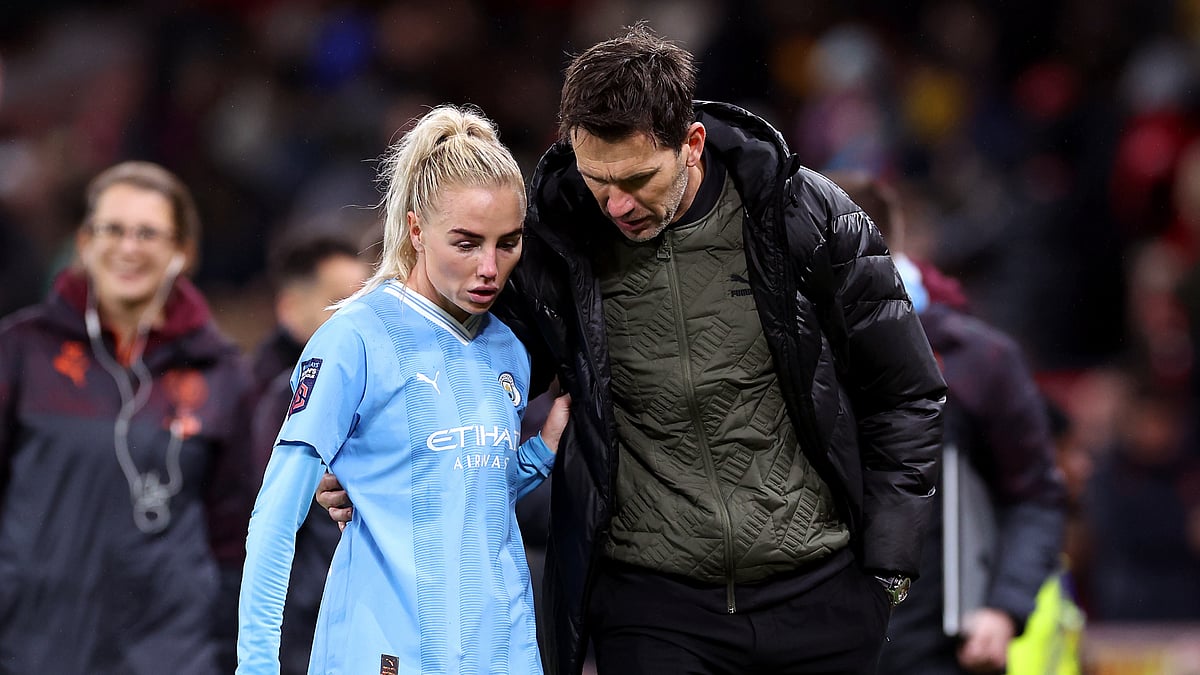 Alex Greenwood and Gareth Taylor in action for Manchester City.