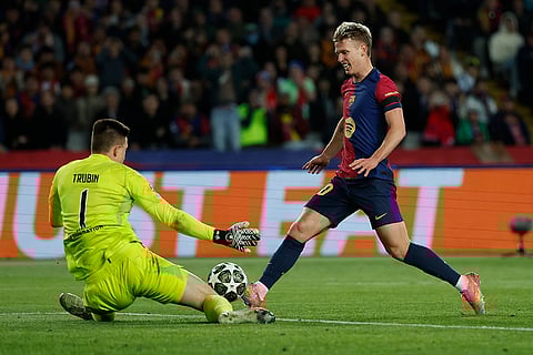 UCL 2024-25, FCB Vs Benfica: Benfica's goalkeeper Anatoliy Trubin, left, makes a save 