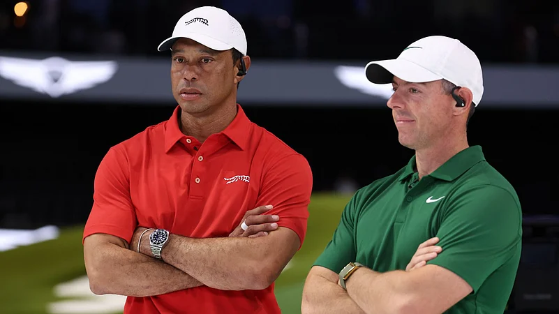 McIlroy (right) empathises with Woods