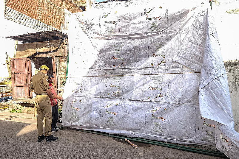 The Shahi Jama Masjid being covered in tarpaulin in Sambhal