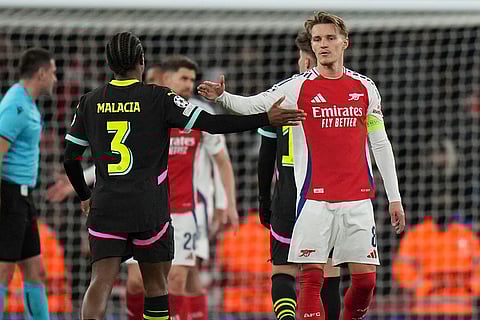 UCL 2024-25, Arsenal vs PSV: Arsenal's Martin Odegaard, right, and PSV's Tyrell Malacia greet each other after the match