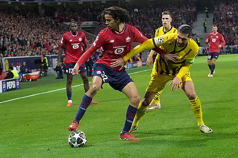 UCL 2024-25, Lille vs Dortmund: Lille's Edon Zhegrova and Dortmund's Emre Can fight for the ball 