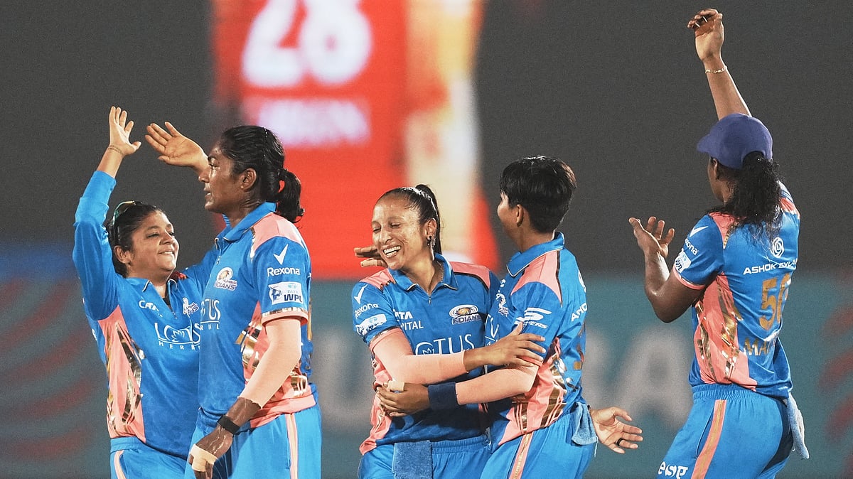 PTI : Mumbai Indians players celebrate the wicket of Gujarat Giants' Harleen Deol during the Women's Premier League 2025 Eliminator.
