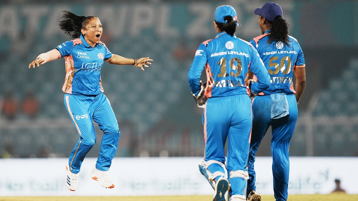 PTI : Mumbai Indians' Shabnim Ismail (left) celebrates with teammates after taking the wicket of Gujarat Giants' batter Beth Mooney during the Women's Premier League Eliminator.