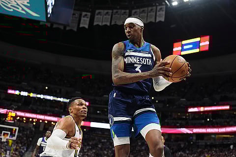 NBA 2024-25, Timberwolves vs Nuggets: Timberwolves forward Jaden McDaniels pulls in a loose ball