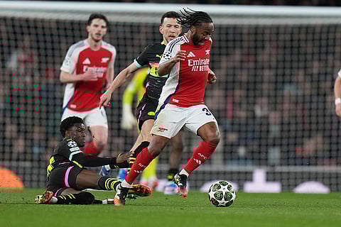 UCL 2024-25, Arsenal vs PSV: PSV's Isaac Babadi challenges for the ball with Arsenal's Raheem Sterling