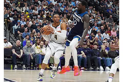 NBA 2024-25, Timberwolves vs Nuggets: Nuggets guard Russell Westbrook drives past Timberwolves forward Julius Randle