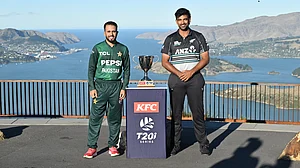 X/Pakistan Cricket : Ish Sodhi (right) and Mohammad Haris pose with the trophy ahead of the New Zealand vs Pakistan T20I series.