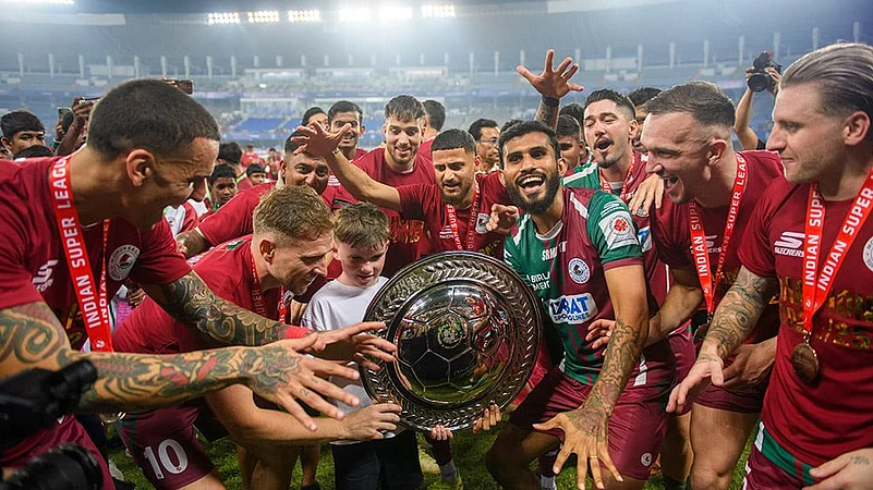 League Shield winners Mohun Bagan pose with the shield
