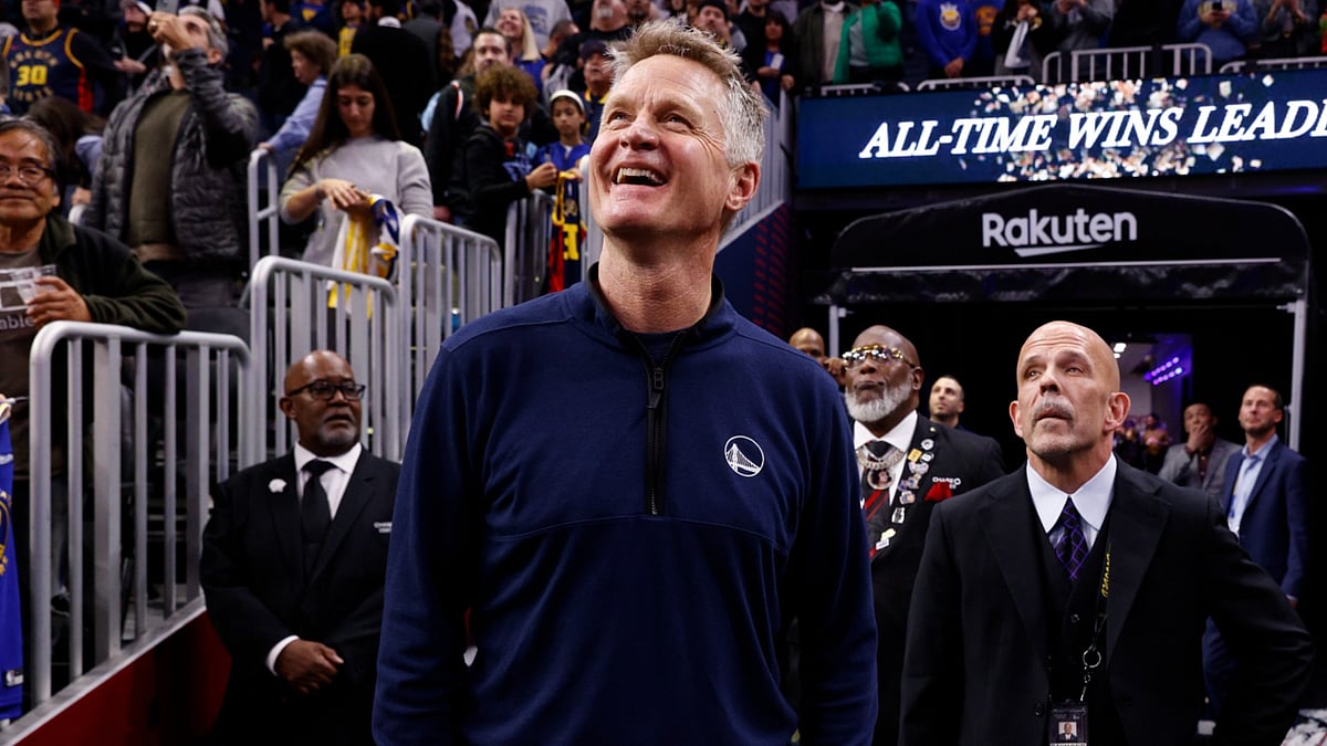 Warriors coach Steve Kerr celebrates his milestone win