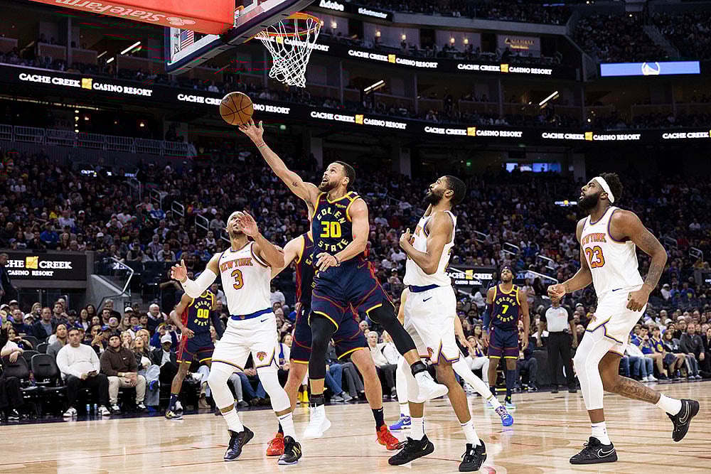 | Photo: AP/Benjamin Fanjoy : NBA 2024-25: Golden State Warriors guard Stephen Curry (30) shoots