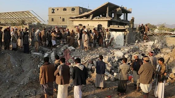  Naif Rahma/Reuters : People gather at the site of a US strike in Yemen