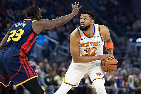 NBA 2024-25: Warriors forward Draymond Green (23) defends against Knicks center Karl-Anthony Towns