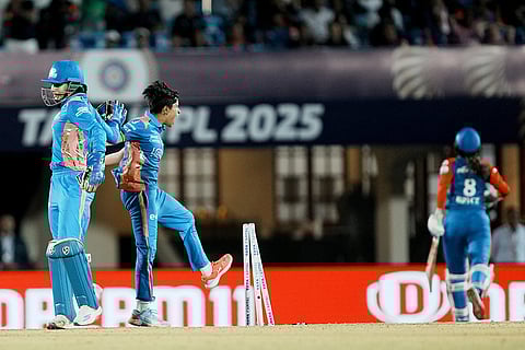 WPL Final 2025 MI vs DC: Mumbai Indians' players celebrate the wicket of Delhi Capitals' Sarah Bryce