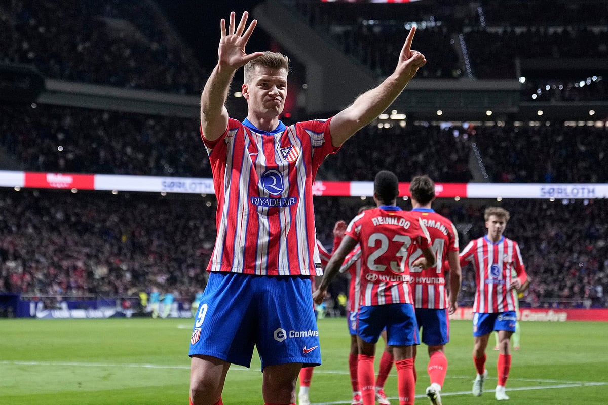 Atletico Madrid's Alexander Sorloth celebrates scoring his side's first goal during a La Liga soccer match between Atletico Madrid and FC Barcelona at the Metropolitano stadium in Madrid, Sunday, March 16, 2025. -  (AP Photo/Bernat Armangue)