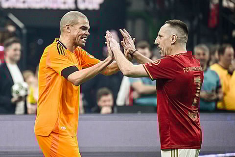 Beckenbauer Cup 2025: Real Madrid's Pepe and Munich's Franck Ribery high-five each other