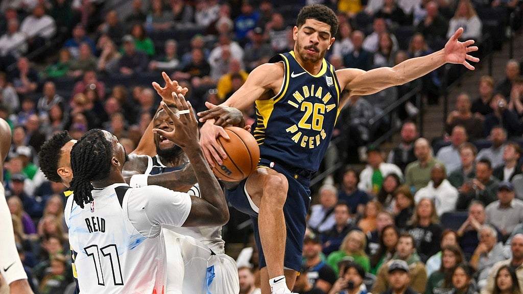 Photo: AP : Indiana Pacers guard Ben Sheppard (26) battles for a rebound with Minnesota Timberwolves players during their NBA game.