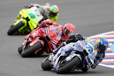 Argentina GP Motorcycle Racing: Alex Marquez, right, Marc Marquez, center, and Franco Morbidelli