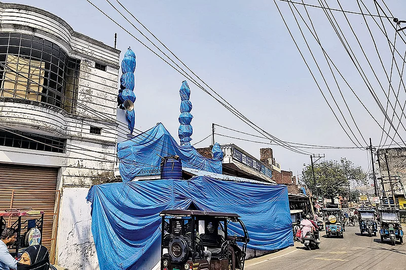A mosque covered up ahead of the ‘Laat Saheb’ procession in Shahjahanpur, Uttar Pradesh