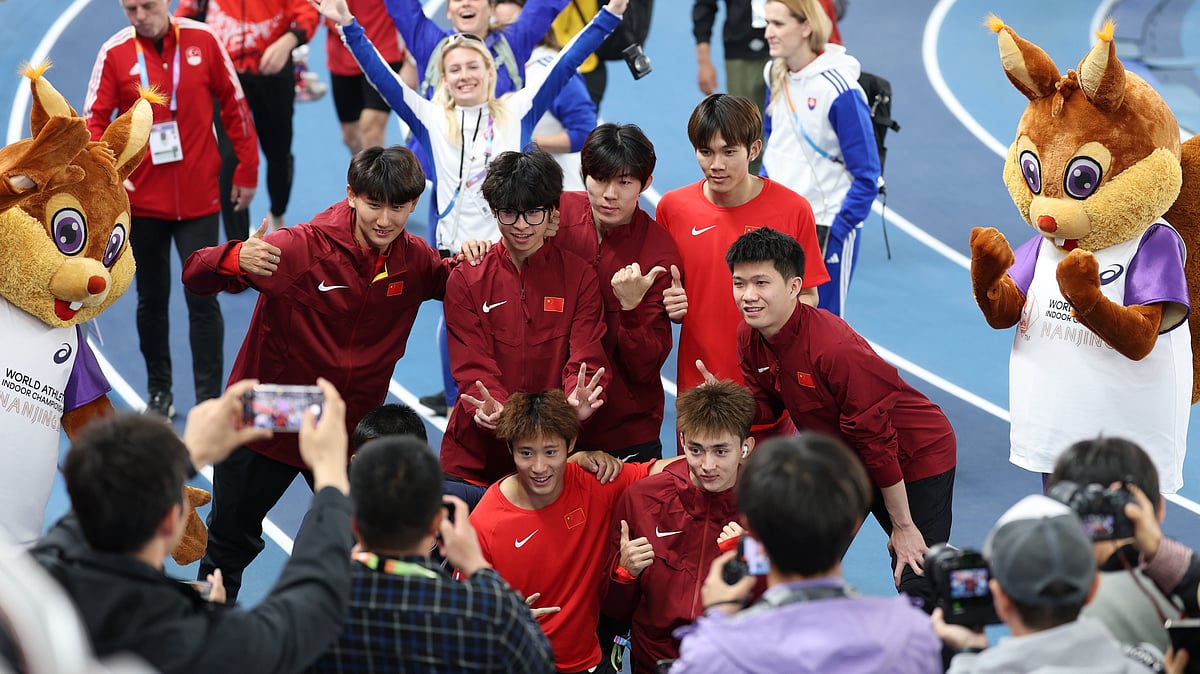 Photo: X | China Daily : Chinese athletes posing for a photograph in front of their home crowd before the start of World Athletics Indoor Championships 2025.