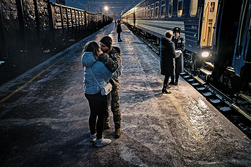 A Ukrainian soldier and his girlfriend say goodbye at a
train station in Kramatorsk, Ukraine