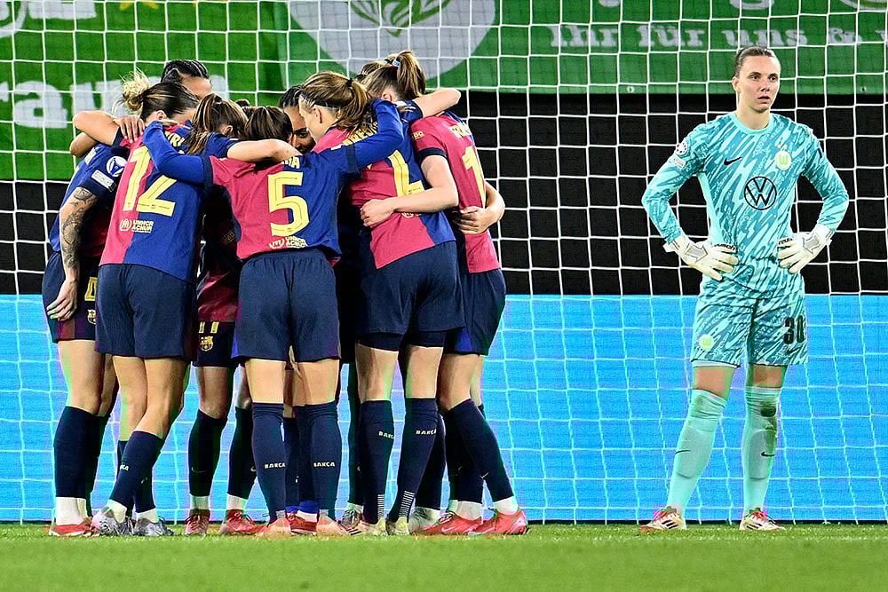 | Photo: Swen Pfoertner/dpa via AP : UWCL Quarter-Finals 1st Leg: VfL Wolfsburg vs FC Barcelona