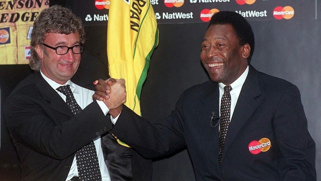 File/AP : Eddie Jordan poses for a photo with former soccer player Pele, Nov. 6, 1998.