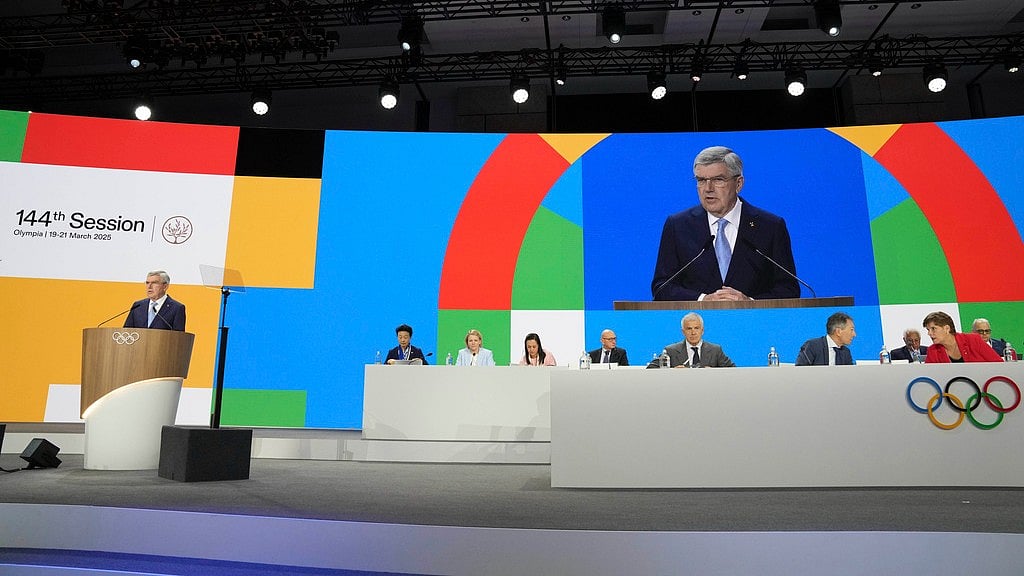 AP/Thanassis Stavrakis : International Olympic Committee President Thomas Bach speaks during the 144th session which will elect the new IOC President, in Costa Navarino, western Greece, Wednesday, March 19, 2025.