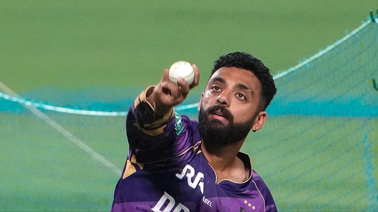 Kolkata Knight Riders player Varun Chakaravarthy bowls during a training session at Eden Gardens in Kolkata, West Bengal on March 18, 2025. KKR take on Royal Challengers Bengaluru in the first match. - PTI