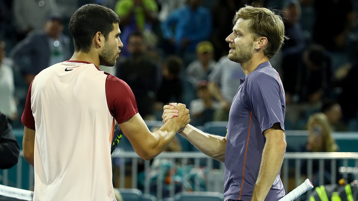 David Goffin shakes hands with Carlos Alcaraz after Friday's victory