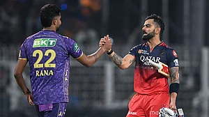 Kohli (right) shakes hands with Rana following the match's conclusion