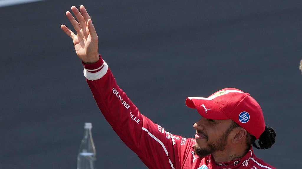 Photo: AP : Ferrari driver Lewis Hamilton of Britain celebrates after winning the sprint race ahead of the Chinese Formula One Grand Prix.