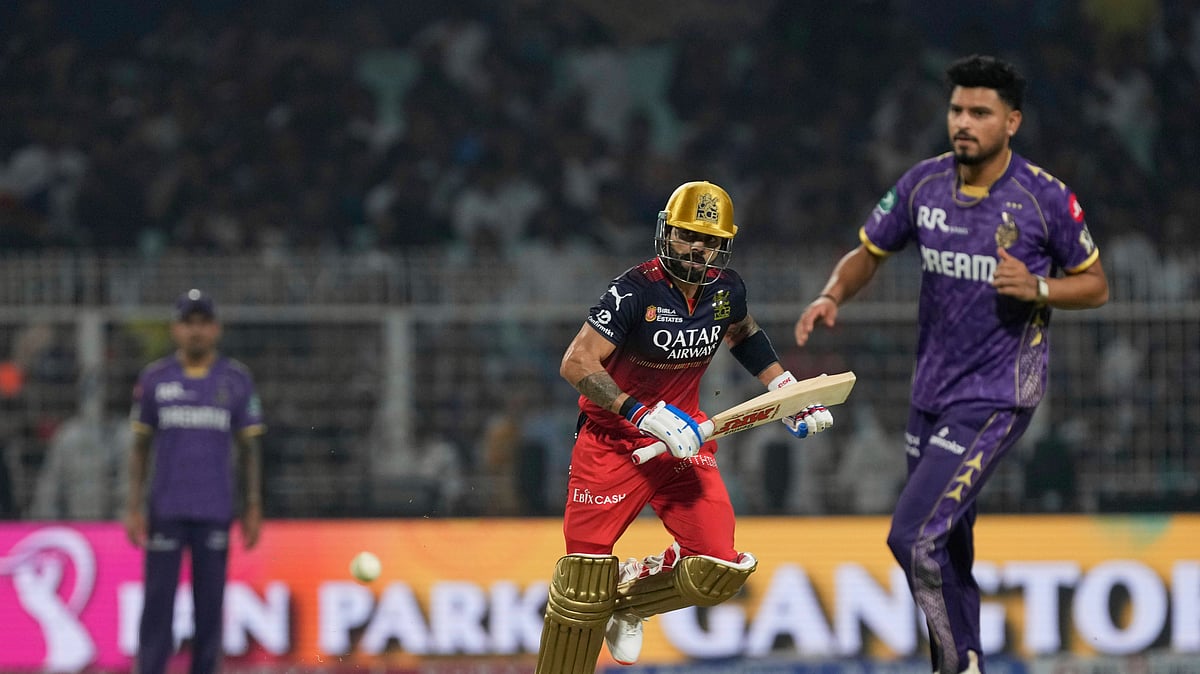 AP Photo/Bikas Das : Royal Challengers Bengaluru's Virat Kohli, center, runs between the wickets to score during the Indian Premier League cricket match between Kolkata Knight Riders and Royal Challengers Bengaluru at Eden Gardens in Kolkata.