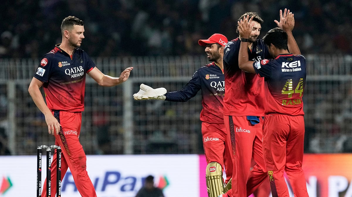 AP Photo/Bikas Das : Royal Challengers Bengaluru's Rasikh Dar, right, celebrates with teammates after the dismissal of Kolkata Knight Riders' Sunil Narine during the Indian Premier League cricket match between Kolkata Knight Riders and Royal Challengers Bengaluru at Eden Gardens in Kolkata.