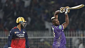 Photo: X | Royal Challengers Bengaluru : KKR's Andre Russell with RCB wicketkeeper Jitesh Sharma after losing his wicket in the IPL 2025 opener.