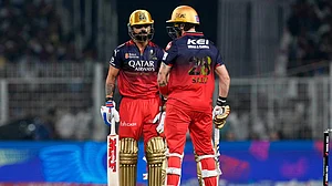 AP/Bikas Das : Phil Salt, left, and batting partner Virat Kohli have a chat during the Indian Premier League cricket match on Saturday.