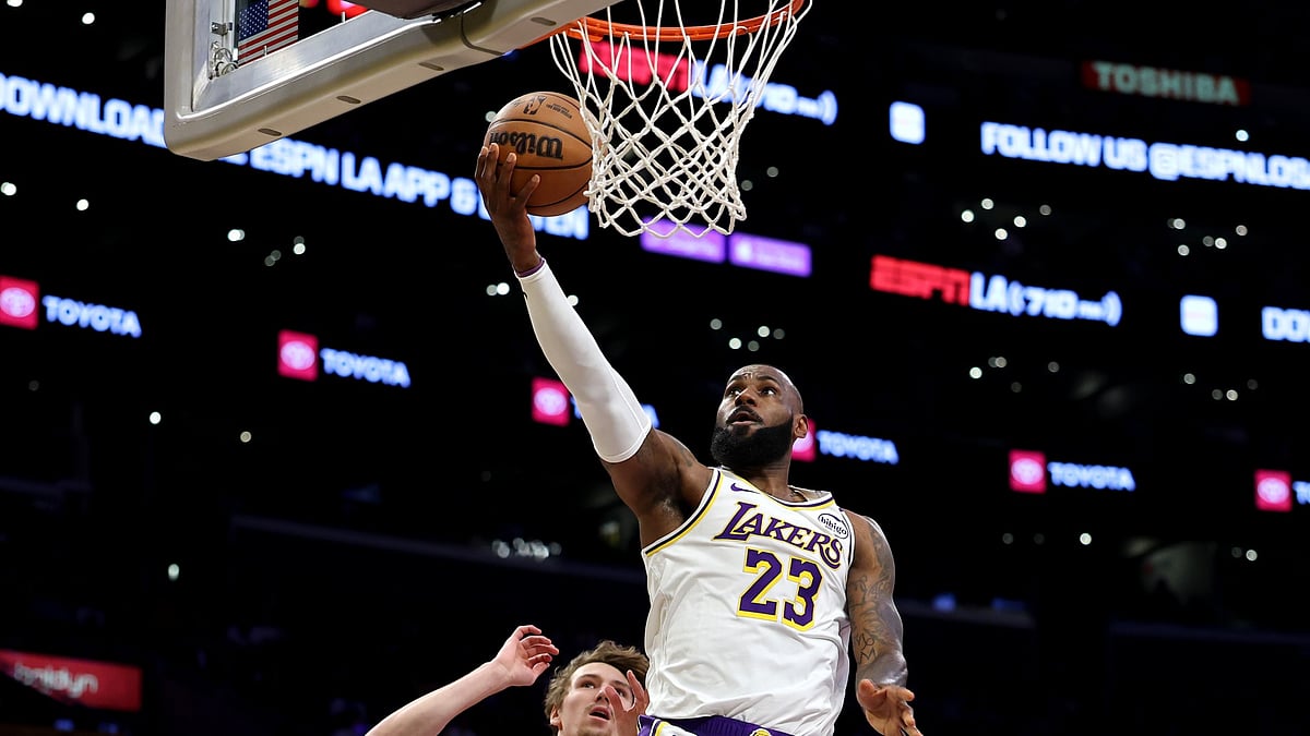 LeBron James #23 of the Los Angeles Lakers shoots the ball as Matas Buzelis #14 of the Chicago Bulls defends during the first quarter at Crypto.com Arena on March 22, 2025 in Los Angeles, California.