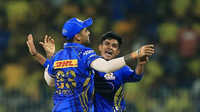 Mumbai Indians' Vignesh Puthur, right, and captain Suryakumar Yadav celebrate the dismissal of Chennai Super Kings' captain Ruturaj Gaikwad during the Indian Premier League cricket match between Chennai Super Kings and Mumbai Indians in Chennai. - AP Photo/R. Parthibhan