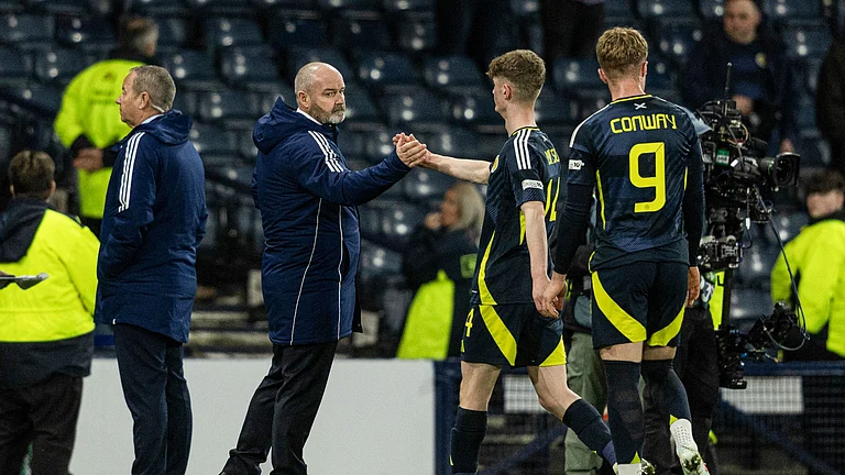 Scotland manager Steve Clarke with James Wilson and Tommy Conway. - null