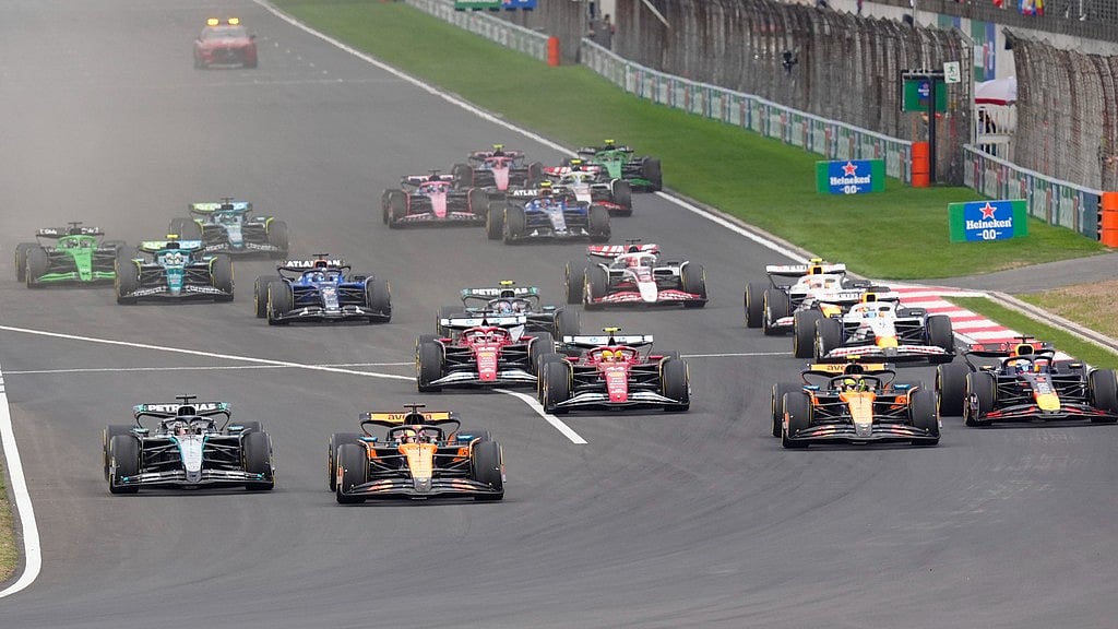 AP : McLaren driver Oscar Piastri of Australia, second left, leads the field after the start of the Chinese Formula One Grand Prix race at the Shanghai International Circuit.