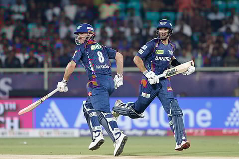 Lucknow Super Giants' Aiden Markram and Mitchell Marsh run between the wickets to score during the Indian Premier League cricket match between Delhi Capitals and Lucknow Super Giants at ACA–VDCA Cricket Stadium in Visakhapatnam, India, Monday, March 24, 2025.