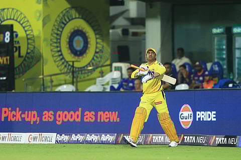 Chennai Super Kings' Mahendra Singh Dhoni steps out to bat during the Indian Premier League cricket match between Chennai Super Kings and Mumbai Indians in Chennai.