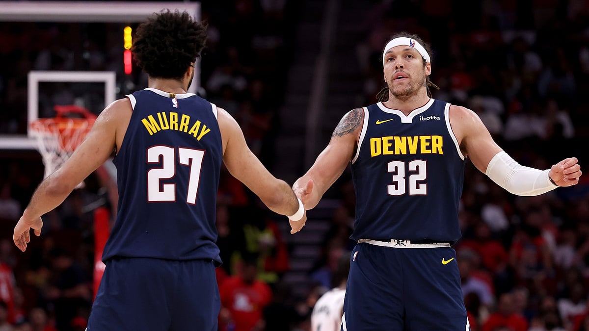 Denver Nuggets guard Jamal Murray congratulates teammate Aaron Gordon vs. the Houston Rockets on March 23, 2025.