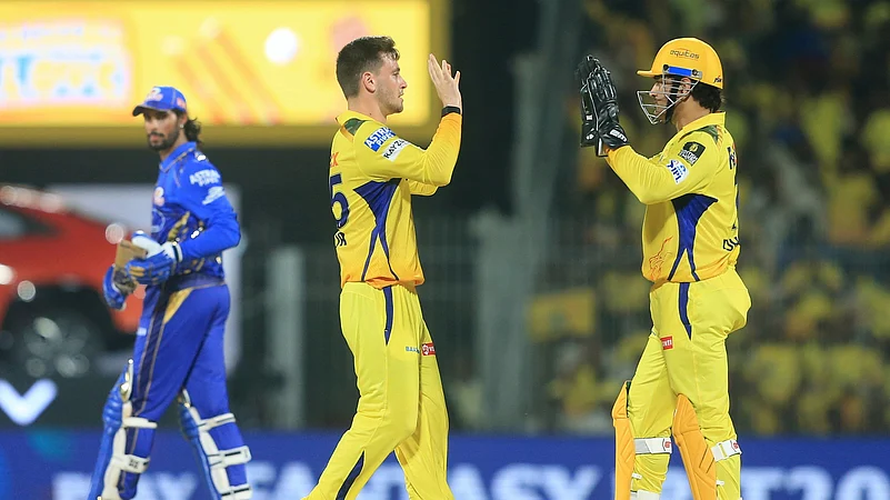 Chennai Super Kings Noor Ahmad, centre, celebrates. AP