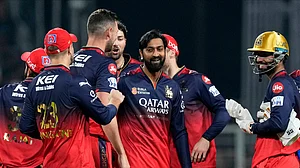 AP Photo/Bikas Das : Royal Challengers Bengaluru's Krunal Pandya, center, celebrates with teammates after the dismissal of Kolkata Knight Riders' Venkatesh Iyer during the Indian Premier League cricket match between Kolkata Knight Riders and Royal Challengers Bengaluru at Eden Gardens in Kolkata.