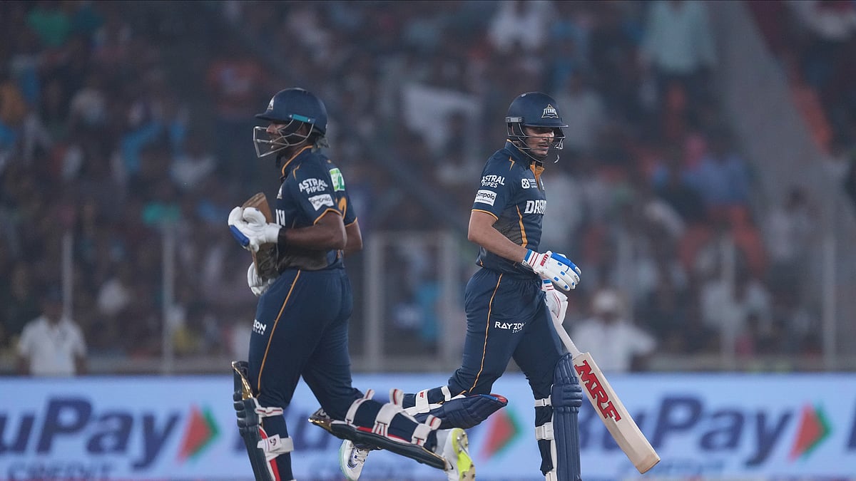 AP Photo/Ajit Solanki : Gujarat Titans' captain Shubman Gill and batting partner Sai Sudharsan run between the wickets to score during the Indian Premier League cricket match between Gujarat Titans and Punjab Kings at Narendra Modi Stadium in Ahmedabad.